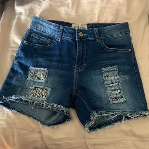 Cut off jean shorts with sequined patches
